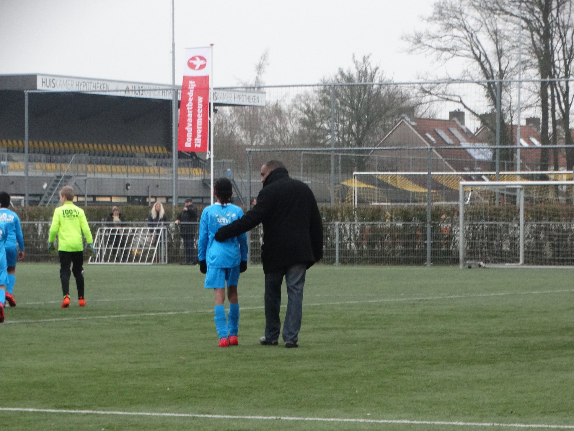 Steven coaching his son on the field
